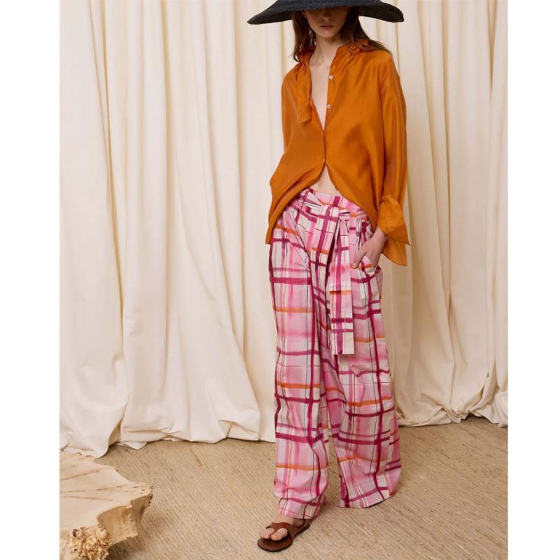 IS COMING - Pantalon large à rayures 